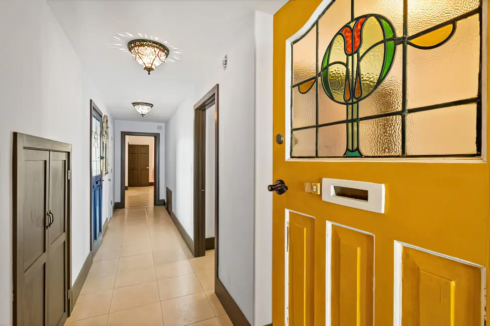 First floor hallway and stained glass door