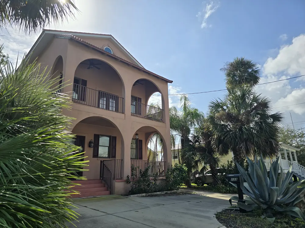 Front of villa with tropical foliage