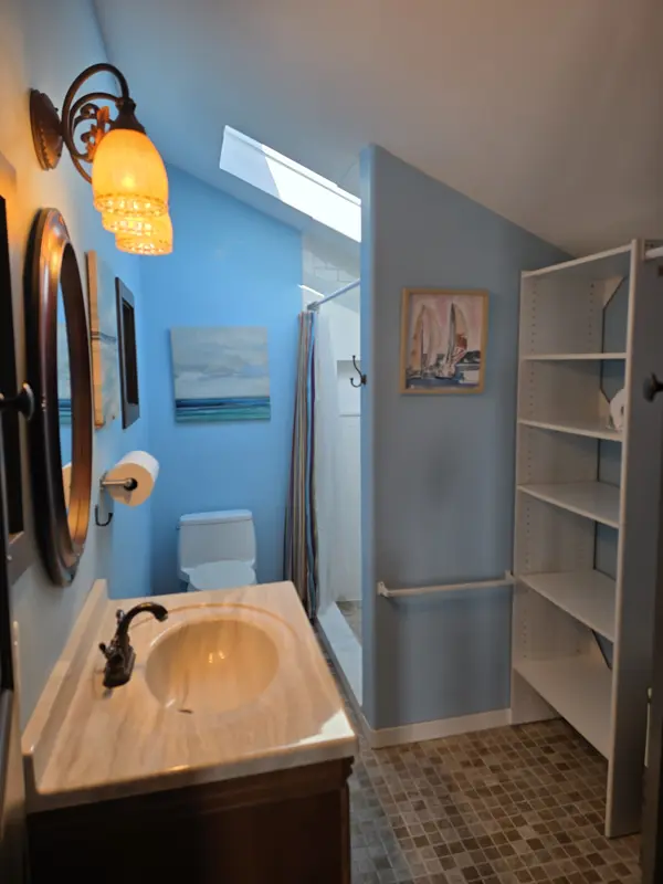 The "Nautical" bedroom has a private bathroom with a walk-in shower