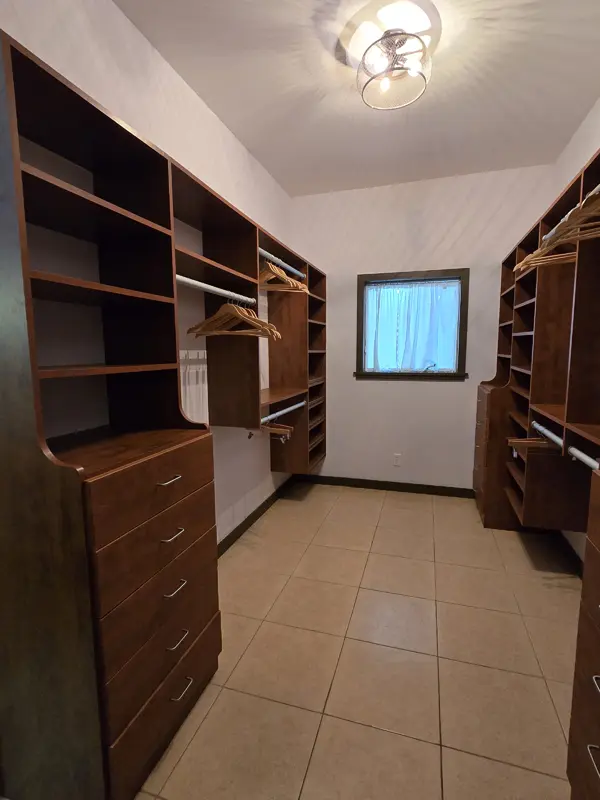 Crimson bedroom walk in closet